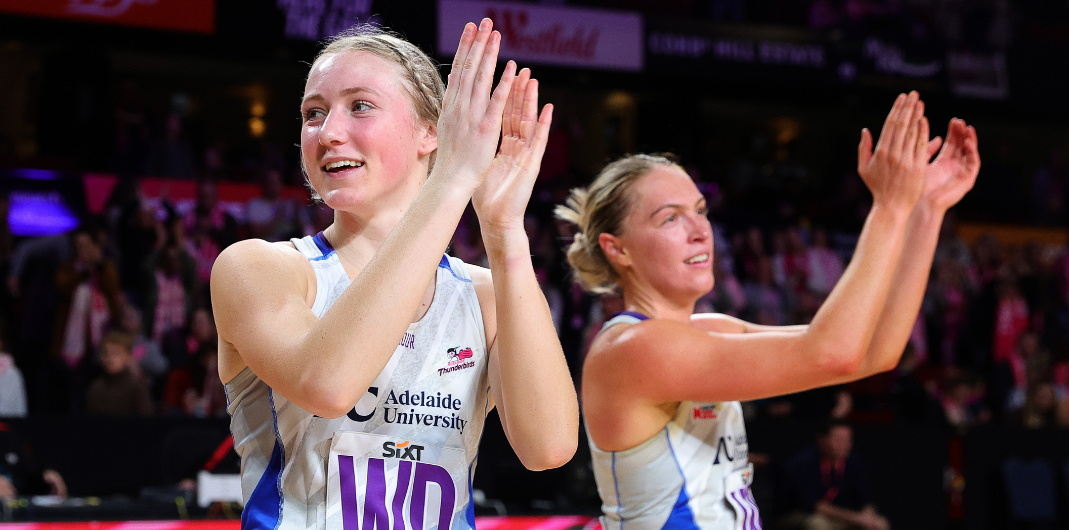 Sanmarie Visser and Hannah Petty applaud the Thunderbirds fans.